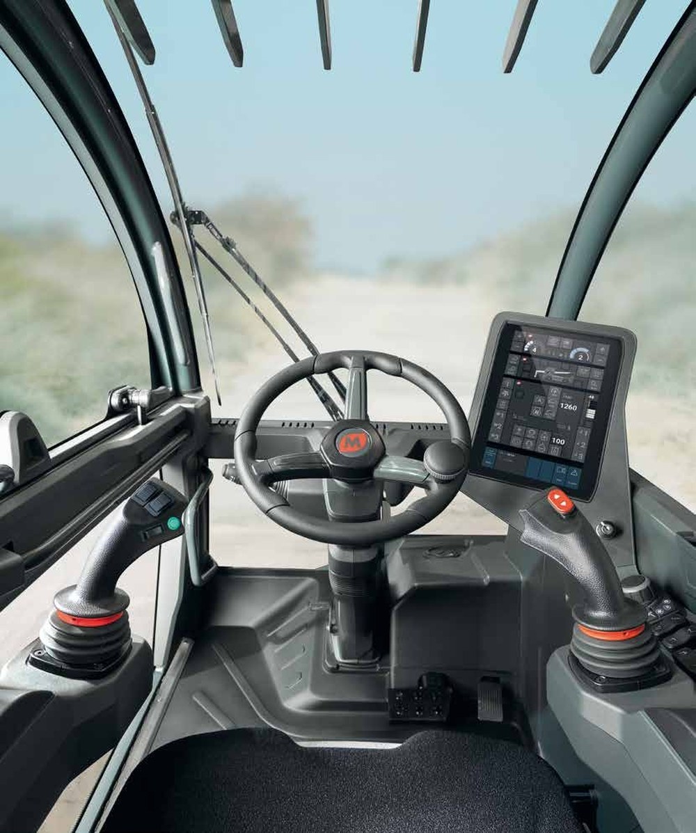 Magni RTH 8.39 cab interior with dual joysticks and 12-inch MCTS touchscreen